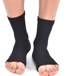 Black compression foot sleeves for sports and ankle support, unisex breathable athletic socks.