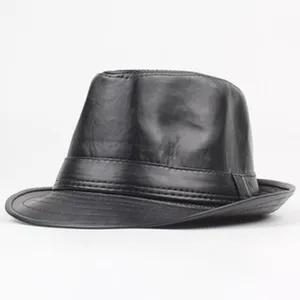 Detailed view of the classic black leather fedora hat, showing smooth texture and fine brim.