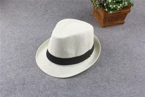 Classic white fedora straw hat with black band for summer sun protection and vacation.