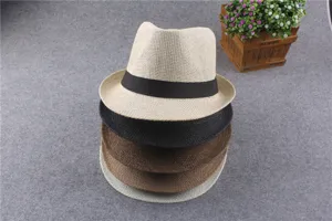 Detailed view of stacked woven straw fedora hats in various colors, perfect for summer resort wear.