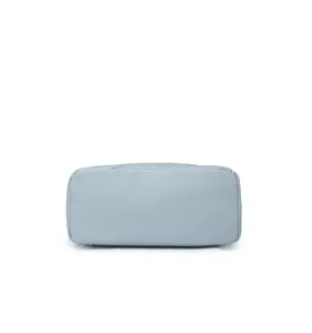 Detailed bottom view of a light blue leather backpack, showing durable texture and stitching.
