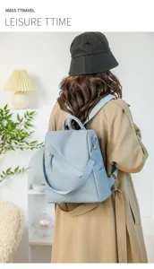 Blue leather backpack for women, stylish anti-theft casual daypack with spacious capacity.