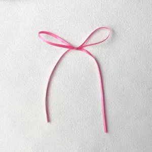 Sweet pink ribbon bow for cake decoration, delicate 0.3cm trim for festive baking and dessert styling.