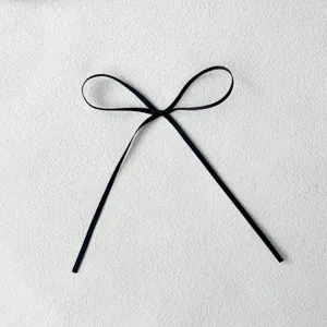 Black ribbon bow decoration, 0.3cm width, perfect for cake baking and festival party crafts.