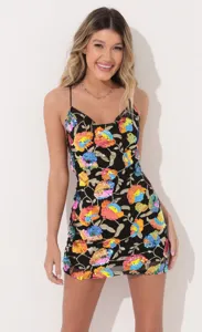 Stunning black sequin floral mini dress with delicate spaghetti straps for parties and events.