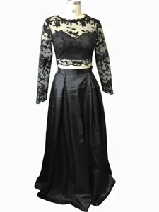 Detailed view of the elegant black lace long sleeve two piece evening dress with satin skirt.