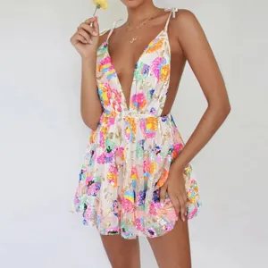 Detail view of sexy deep V-neck backless sequin floral dress showing sparkling design elements.