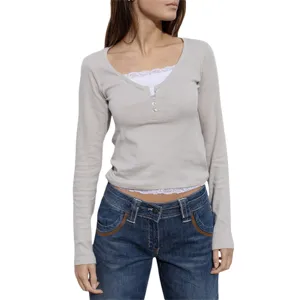 Detailed view of the slim-fit long-sleeve T-shirt featuring elegant lace trim and button accents.