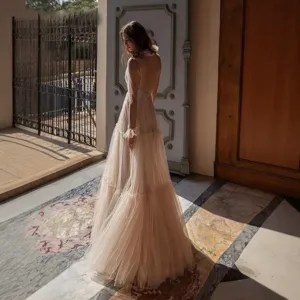 Stunning deep V sheer sequin evening long dress with elegant layered tulle design.