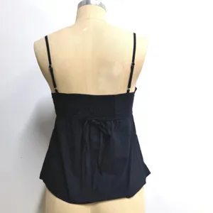 Black camisole back view detail showcasing adjustable straps, smocked band, and a cute back tie.