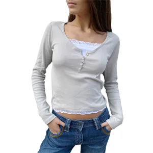 Women's slim fit false two-piece long sleeve t-shirt with white lace trim and front buttons.
