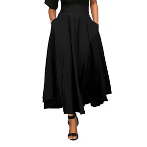 Black high-waisted maxi skirt detail shot showcasing fabric flow, waistline and pockets.