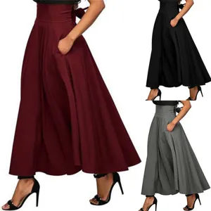 Detailed view of high-waist maxi skirt showing pocket design and elegant bow back detail.