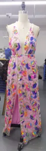Detailed close-up view of the deep V neck sequin floral embroidered slit long dress in detail.