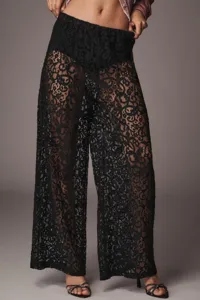 Pantaloni larghi in pizzo nero trasparente, pantaloni eleganti a vita alta con motivi floreali.