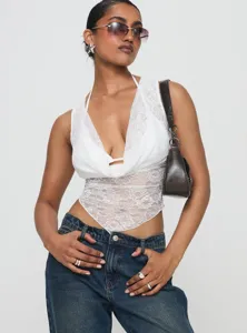 White lace halter top detail showcasing delicate floral patterns and sexy V-neck design.