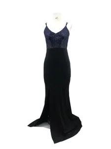 Detail view of the black sequin slip evening dress, featuring front slit and backless design.