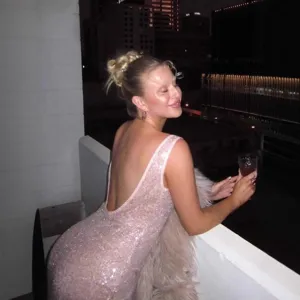 Backless pink sequin dress detail showing sleeveless design and glittering fabric.