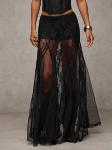 Close-up detail of the black lace patchwork long skirt featuring sheer mesh panels.