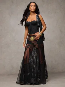 Details of the edgy black lace patchwork low-waist maxi skirt and matching bustier top.