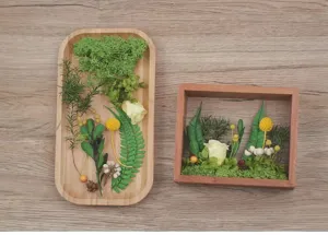 Detail view of wooden shadow box frame and dried flower DIY materials set for craft projects.