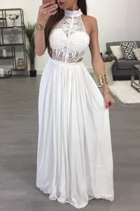 Detailed view of the elegant white lace halter top and flowing long skirt outfit.
