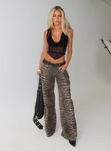 Close-up detail showcasing the black lace v-neck sleeveless design and stylish outfit presentation.