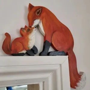 Hand-painted wooden fox family door frame ornament featuring adult and cub figurines