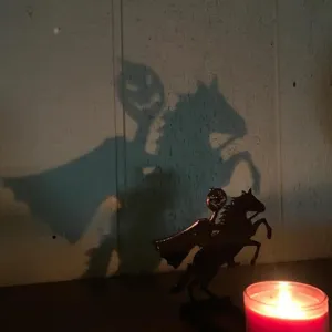 Halloween shadow candle holder desktop ornament with scary horseman projection design.