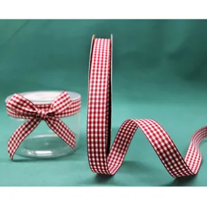 Red and white gingham ribbon detail shot, perfect for gift wrapping, crafts, and floral decoration.
