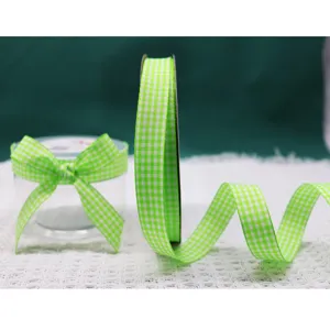 Green gingham plaid ribbon detail for gift wrapping, DIY crafts, flower bouquet and party decor.