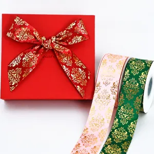 Detailed view of 4cm gold foil printed ribbon and gift box set, perfect for gift wrapping.