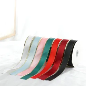 Close-up detail of colorful satin ribbons with gold edges, perfect for DIY gift craft bows.