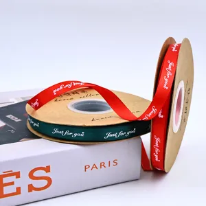 Detailed shot of 1cm polyester ribbon with printed English letters for DIY gift wrapping and bows.