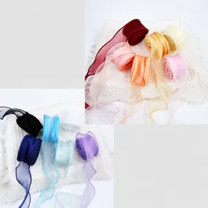 Detailed view of colorful fish-tail yarn organza ribbon rolls, 4cm wave edge for floral wrap.