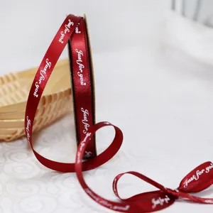 1cm red ribbon detail showing white just for you text print and elegant bow design.