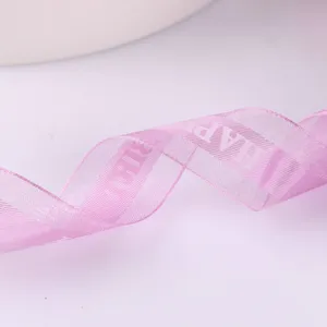 Pink sheer ribbon detail showing woven Happy Birthday text, ideal for cake packaging and gifts.