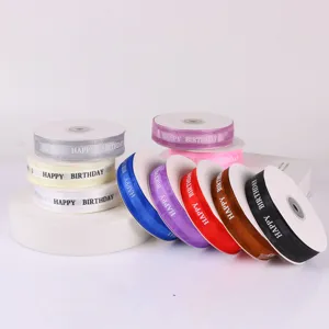 Detailed view of colorful 2.5cm Happy Birthday printed ribbon rolls for gift wrapping and decor.
