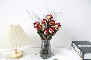 Natural dried rose flower bouquet with glass vase for home decor and vintage room decoration