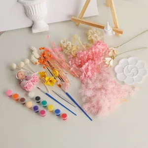 DIY 3D dried flower oil painting kit with preserved flowers, paints, brushes and craft tools.
