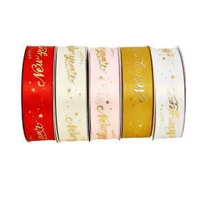 Set of 5 colorful New Year gift wrapping ribbons with gold foil star prints for holiday decor.