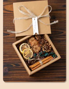Kraft paper gift box set with dried lemon slices pinecones and cinnamon for festival packaging