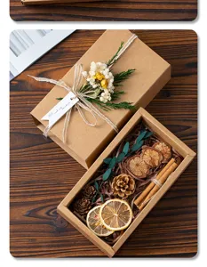 Kraft paper gift box set with dried flowers, pine cones, and cinnamon, vintage style.