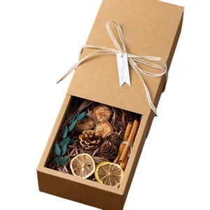 Kraft paper gift box with dried flowers pine cones cinnamon natural rustic style for present