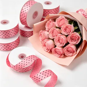 Pink polka dot ribbon for gift wrapping, bouquet packaging, and craft decoration.