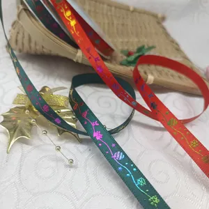 Christmas hot stamping ribbon detail showing green and red polyester webbing for decoration.