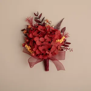 Red preserved hydrangea boutonniere, wedding floral brooch detail for groom and groomsmen.