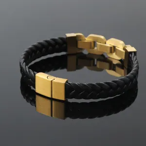 Macro view of gold stainless steel magnetic clasp on black braided men's bracelet
