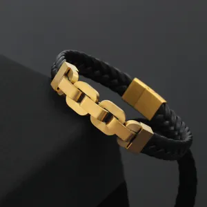 Close-up of men's black braided leather bracelet with golden stainless steel magnetic clasp