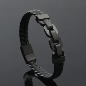Close-up of black braided leather bracelet with matte black stainless steel links.